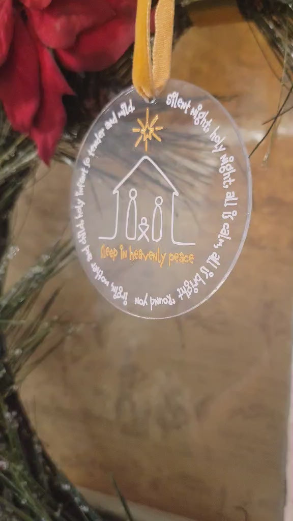 This is showing the ornament lighting so you can clearly see the metallic gold writing and clear nature of the ornament.